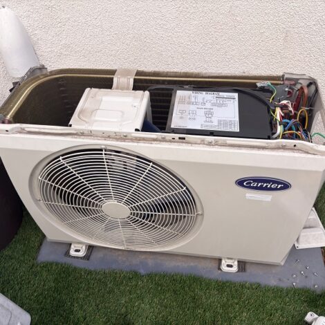 Outdoor air conditioning equipment opened for inspection