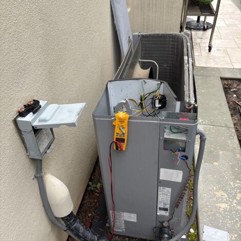Electrical testing at an outdoor HVAC unit
